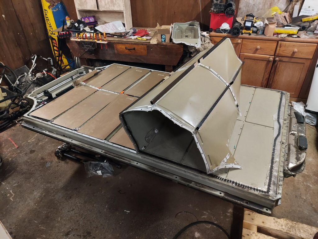 Showing the lid of a Tesla Model S Battery Pack being opened