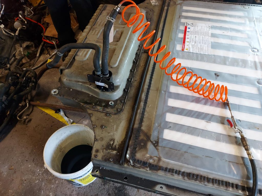 Using compressed air to clear the battery